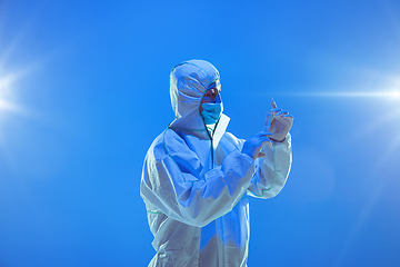 Image showing Medic in white hazmat protective suit, coronavirus illustration concept