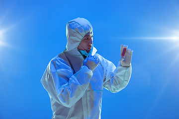 Image showing Medic in white hazmat protective suit, coronavirus illustration concept