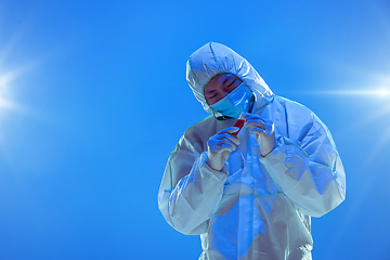 Image showing Medic in white hazmat protective suit, coronavirus illustration concept