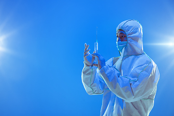 Image showing Medic in white hazmat protective suit, coronavirus illustration concept