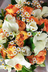 Image showing Close up of fashion modern bouquet of different flowers on wooden background