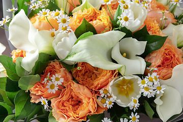 Image showing Close up of fashion modern bouquet of different flowers on wooden background