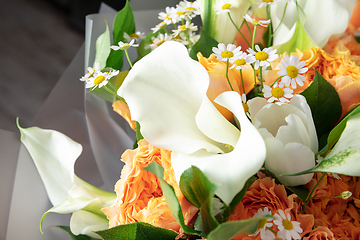 Image showing Close up of fashion modern bouquet of different flowers on wooden background