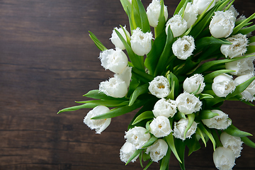 Image showing Close up of fashion modern bouquet of different flowers on wooden background