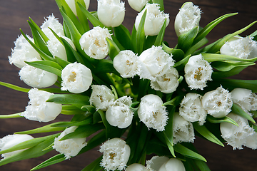 Image showing Close up of fashion modern bouquet of different flowers on wooden background