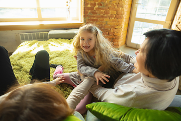 Image showing Happy loving family. Grandmother, mother and daughter spending time together