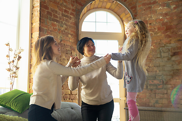 Image showing Happy loving family. Grandmother, mother and daughter spending time together