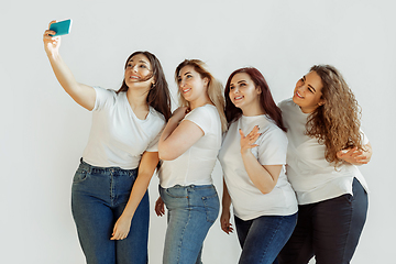 Image showing Young women in casual clothes having fun together. Bodypositive concept.