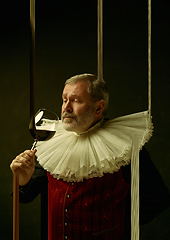 Image showing Senior man as a medieval knight, duke on dark background, stylish creative design