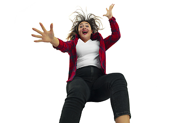 Image showing A second before falling - young girl falling down with bright emotions and expression