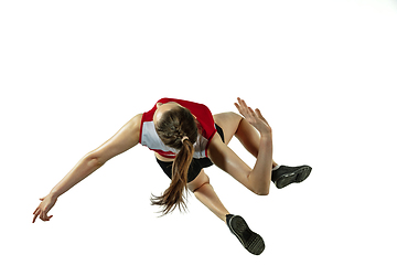 Image showing Young female volleyball player isolated on white studio background in flight and motion