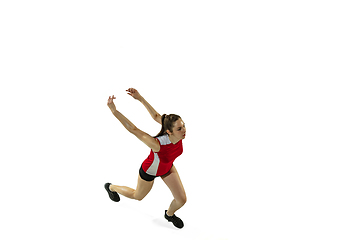 Image showing Young female volleyball player isolated on white studio background in flight and motion