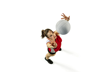 Image showing Young female volleyball player isolated on white studio background in flight and motion