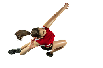 Image showing Young female volleyball player isolated on white studio background in flight and motion