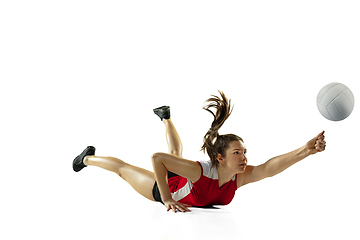 Image showing Young female volleyball player isolated on white studio background in flight and motion