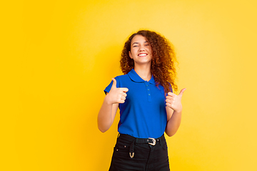 Image showing Caucasian teen\'s girl portrait on yellow background