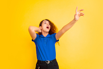 Image showing Caucasian teen\'s girl portrait on yellow background