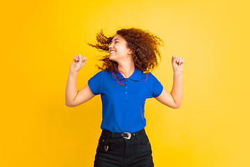 Image showing Caucasian teen\'s girl portrait on yellow background