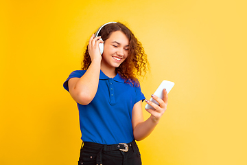 Image showing Caucasian teen\'s girl portrait on yellow background