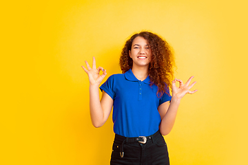 Image showing Caucasian teen\'s girl portrait on yellow background