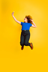 Image showing Caucasian teen\'s girl portrait on yellow background