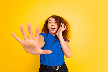 Image showing Caucasian teen\'s girl portrait on yellow background