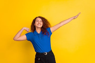 Image showing Caucasian teen\'s girl portrait on yellow background