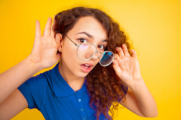 Image showing Caucasian teen\'s girl portrait on yellow background