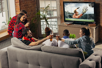 Image showing Excited group of people watching sport match at home