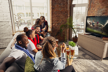 Image showing Excited group of people watching sport match at home