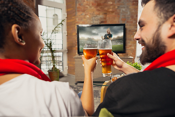 Image showing Excited group of people watching sport match at home