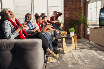 Image showing Excited group of people watching sport match at home