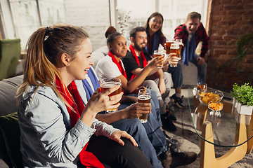 Image showing Excited group of people watching football, sport match at home