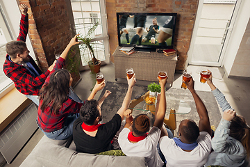 Image showing Excited group of people watching sport match at home