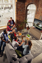 Image showing Excited group of people watching sport match at home