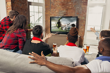 Image showing Excited group of people watching sport match at home