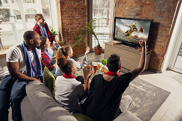 Image showing Excited group of people watching sport match at home