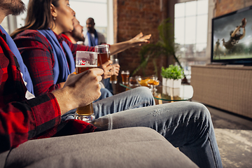 Image showing Excited group of people watching sport match at home