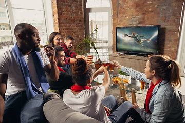 Image showing Excited group of people watching sport match at home