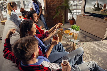 Image showing Excited group of people watching sport match at home