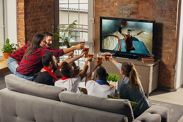 Image showing Excited group of people watching sport match at home