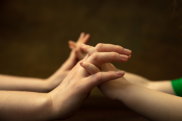 Image showing Close up of female and kid\'s hands doing things together, family, home concept