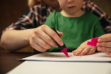 Image showing Close up of female and kid\'s hands doing things together, family, home concept