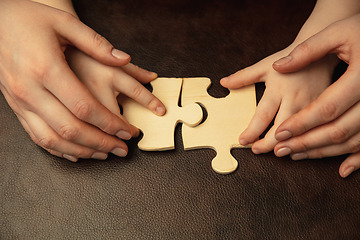 Image showing Close up of female and kid\'s hands doing things together, family, home concept