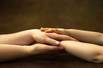 Image showing Close up of female and kid\'s hands doing things together, family, home concept