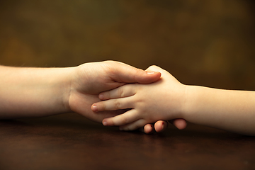 Image showing Close up of female and kid\'s hands doing things together, family, home concept