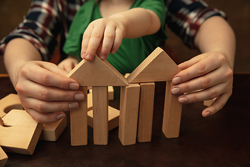 Image showing Close up of female and kid\'s hands doing things together, family, home concept