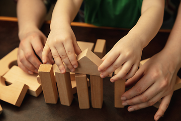 Image showing Close up of female and kid\'s hands doing things together, family, home concept