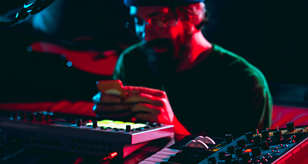 Image showing Close-up of musician performing in neon light. Concept of advertising, hobby, music, festival, entertainment.