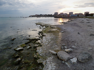 Image showing Rocky seashore at sunset.